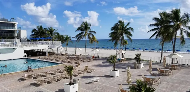 a view of a balcony with furniture