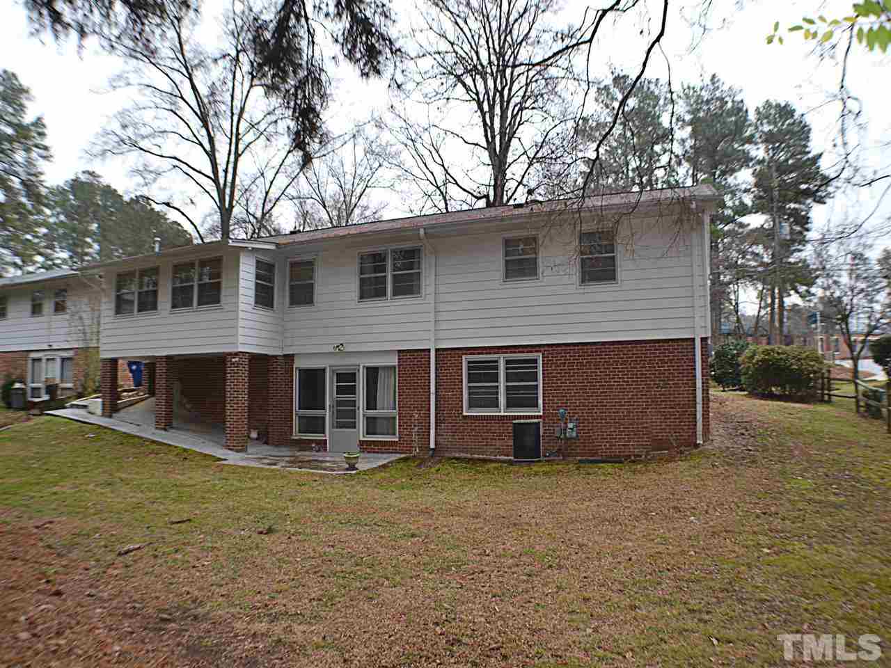 816 Cooper Road Raleigh, NC 27610 - Photo 14 of 18 a view of a house with a yard and large tree