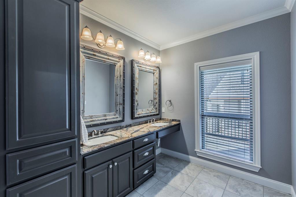 20 Independence Trail Waco, TX 76708 - Photo 37 of 40 a bathroom with a double vanity sink and a mirror