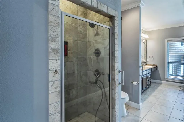 a bathroom with a shower and a sink