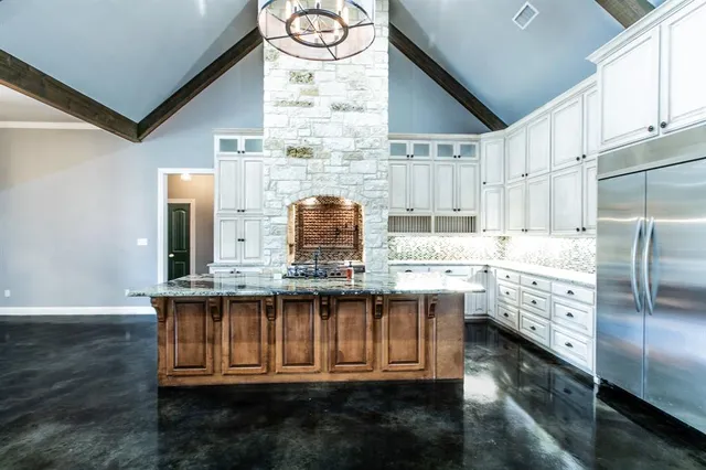 a kitchen with cabinets a sink and appliances