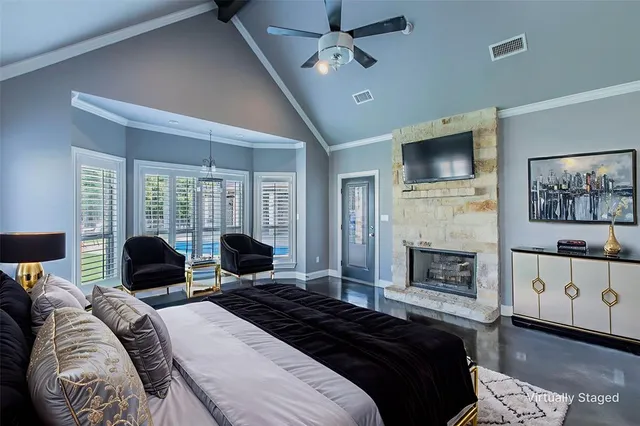 a bedroom with bed and a flat screen tv