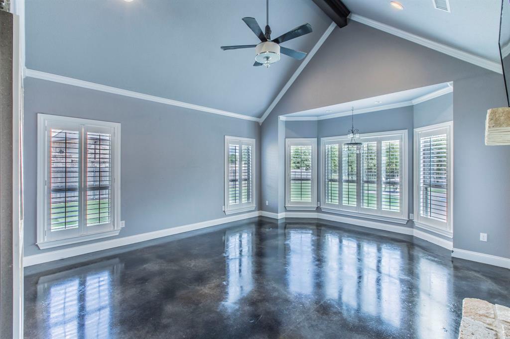 20 Independence Trail Waco, TX 76708 - Photo 9 of 40 a view of an empty room with wooden floor and a window