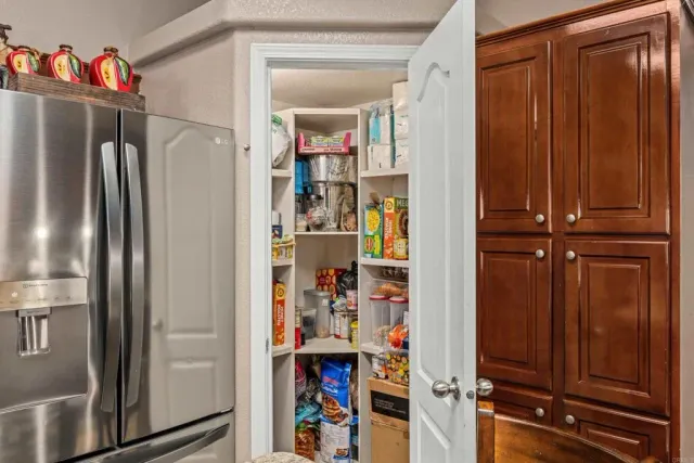 a view of a dining room with furniture wooden floor and chandelier
