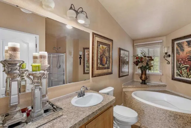 a bathroom with a tub and a shower