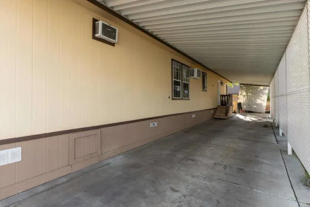a backyard of a house with seating space