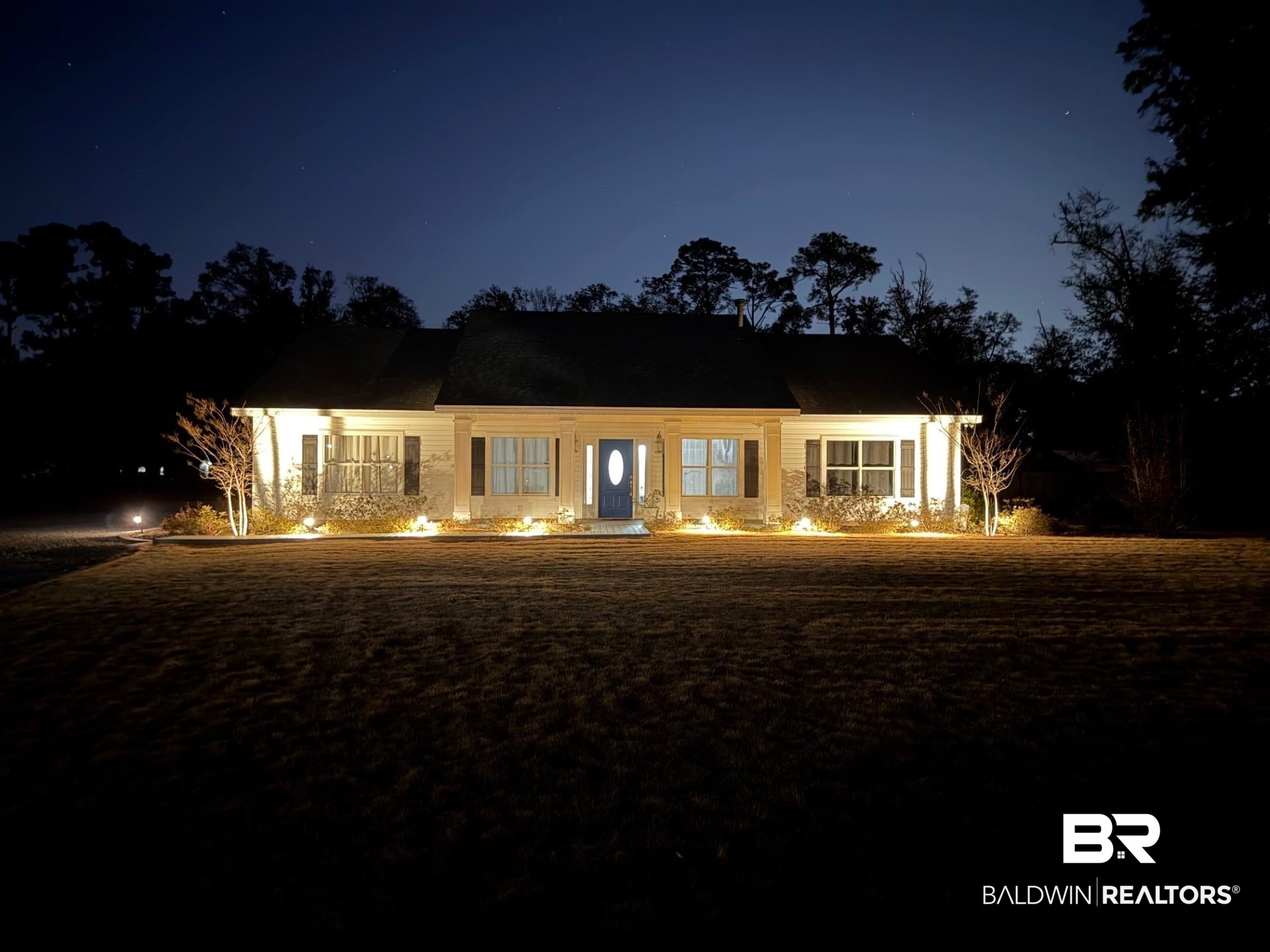 19079 Baldwin County Road 10 Foley, AL 36535 - Photo 2 of 37 Back of house at night with a yard