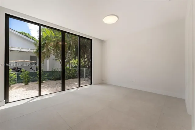 en empty room with sliding glass door