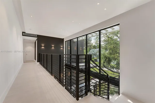 wooden floor in an empty room with glass windows