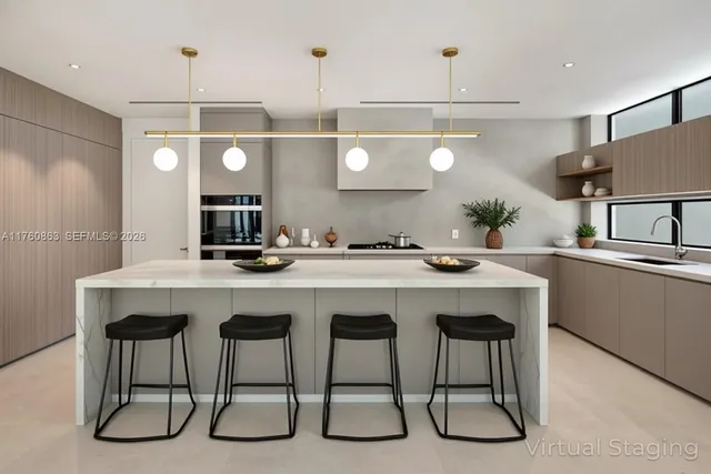 a kitchen with a table and chairs in it