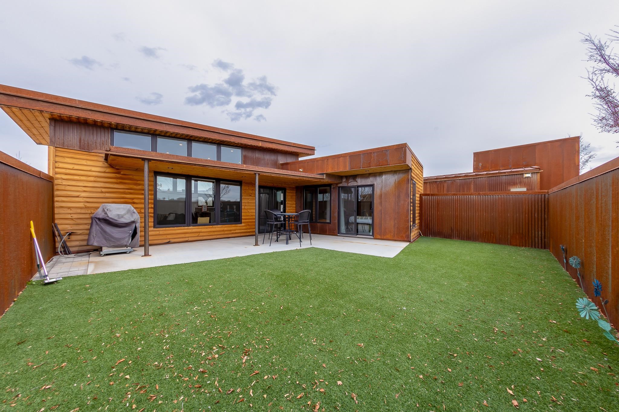 450 Red River Loop Clifton, CO 81520 - Photo 11 of 11 a view of a house with backyard sitting area and garden