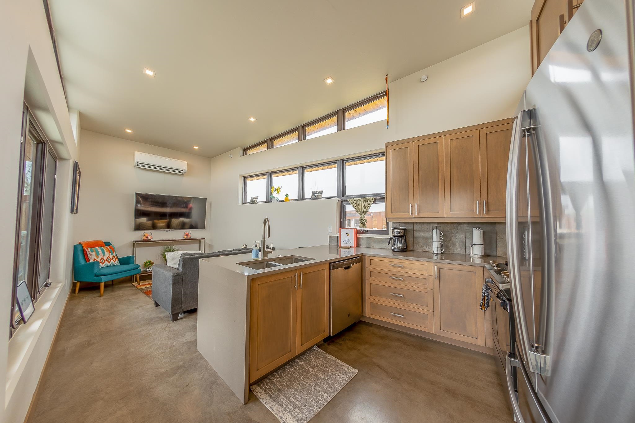 450 Red River Loop Clifton, CO 81520 - Photo 2 of 11 a kitchen with stainless steel appliances a refrigerator a sink a stove top oven a dining table and chairs