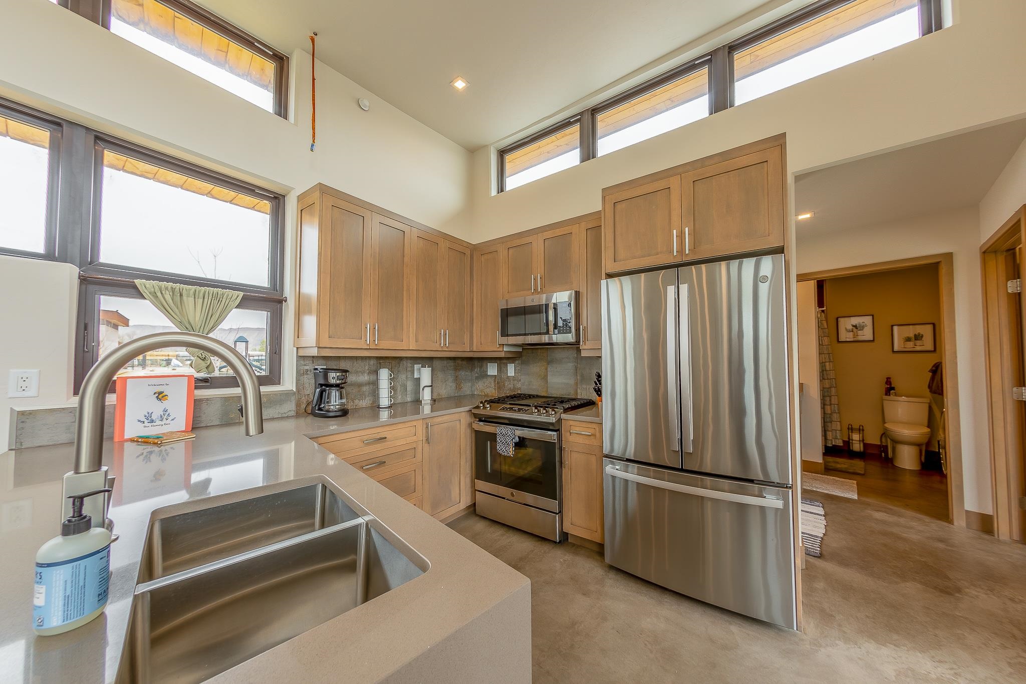 450 Red River Loop Clifton, CO 81520 - Photo 3 of 11 a kitchen with stainless steel appliances granite countertop a refrigerator and a stove top oven