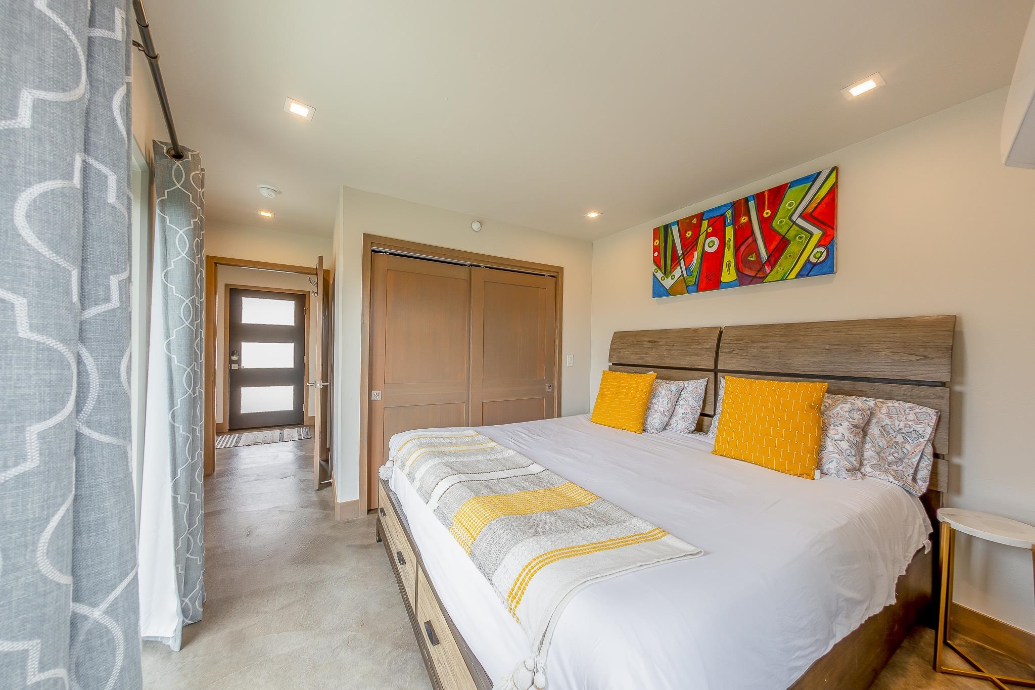 450 Red River Loop Clifton, CO 81520 - Photo 9 of 11 a bedroom with a bed and a painting on the wall