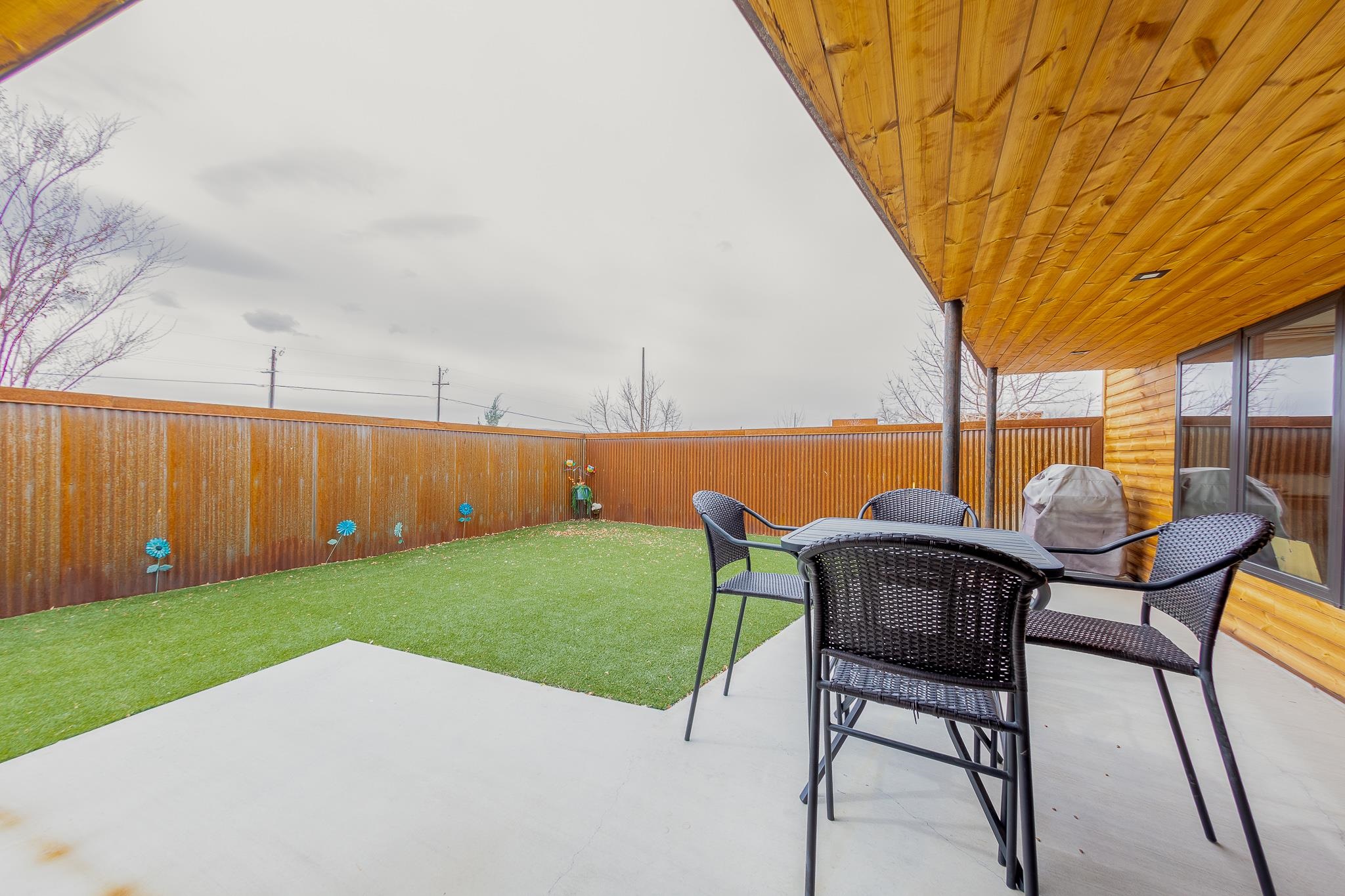 450 Red River Loop Clifton, CO 81520 - Photo 10 of 11 a backyard of a house with table and chairs
