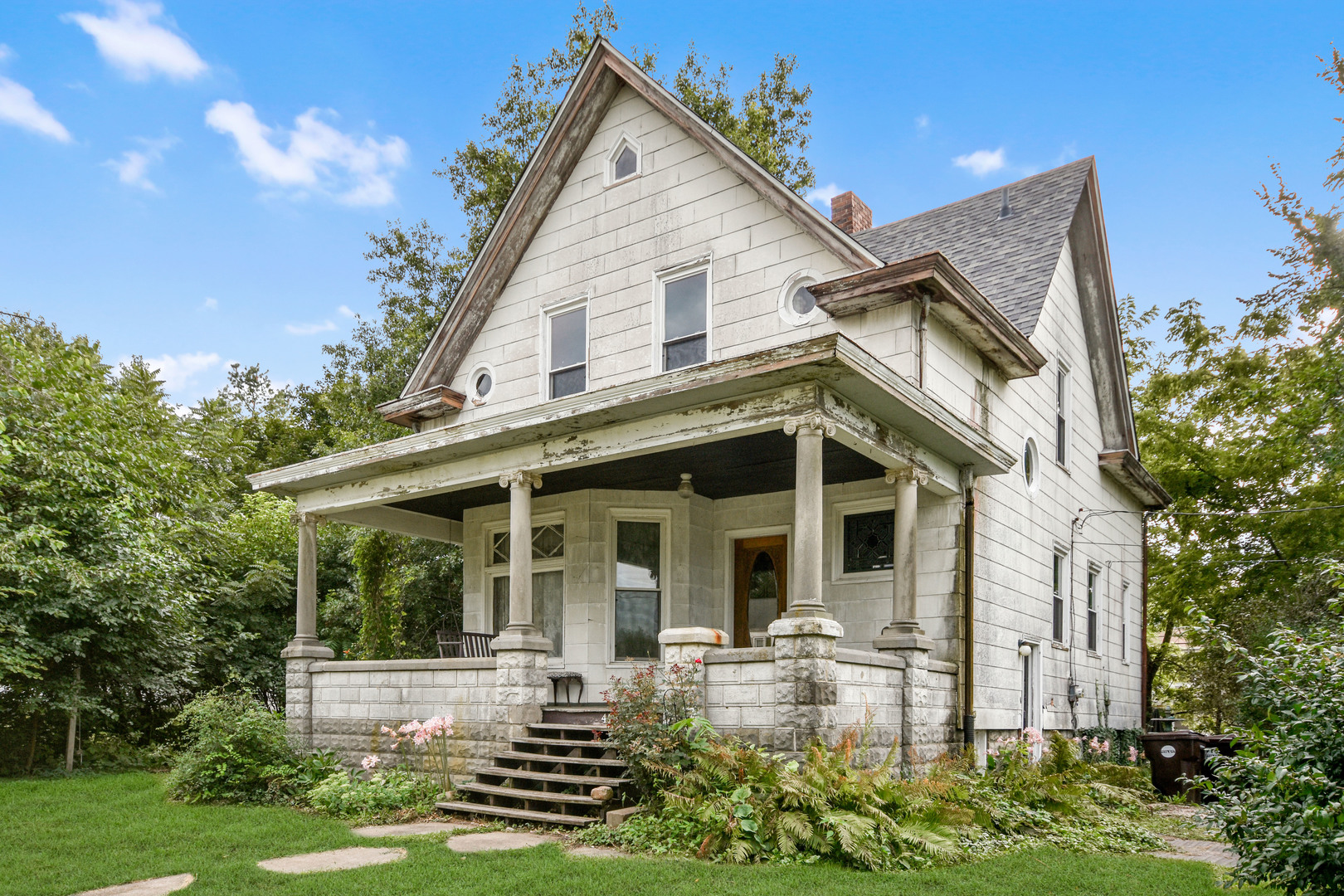 413 North 3rd Street Dunlap, IL 61525 - Photo 1 of 41 a view of a white house with a big yard and potted plants