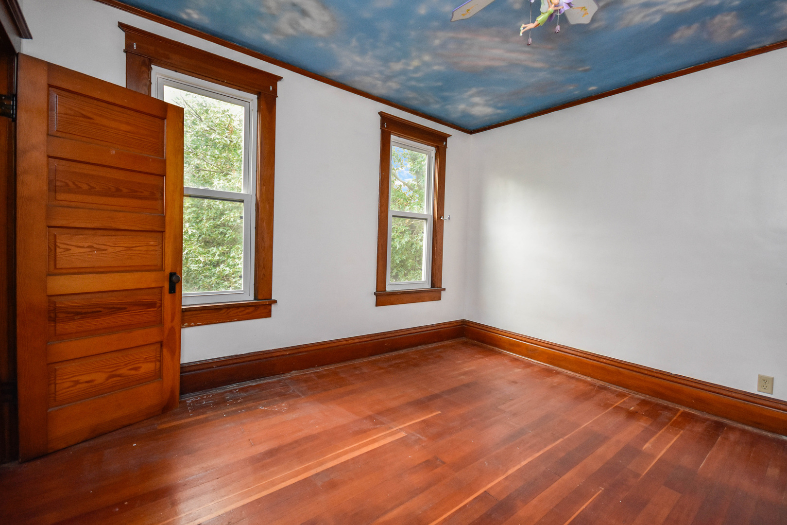 413 North 3rd Street Dunlap, IL 61525 - Photo 29 of 41 a view of an empty room with a window and wooden floor