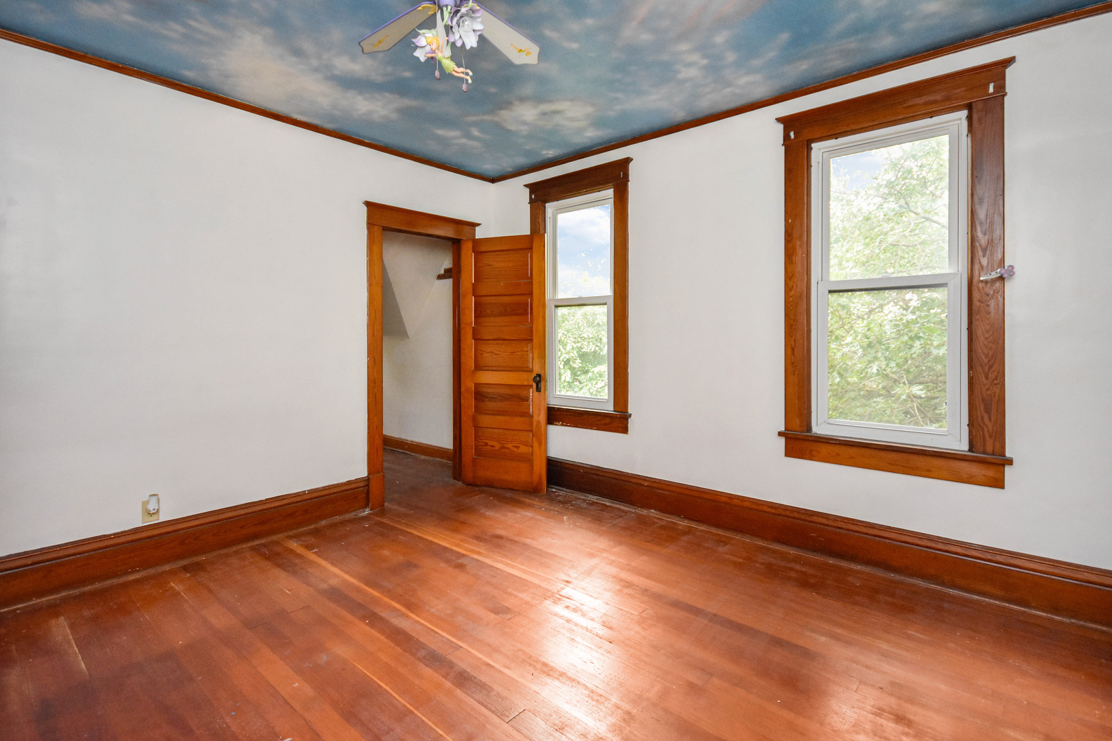413 North 3rd Street Dunlap, IL 61525 - Photo 31 of 41 an empty room with wooden floor and windows