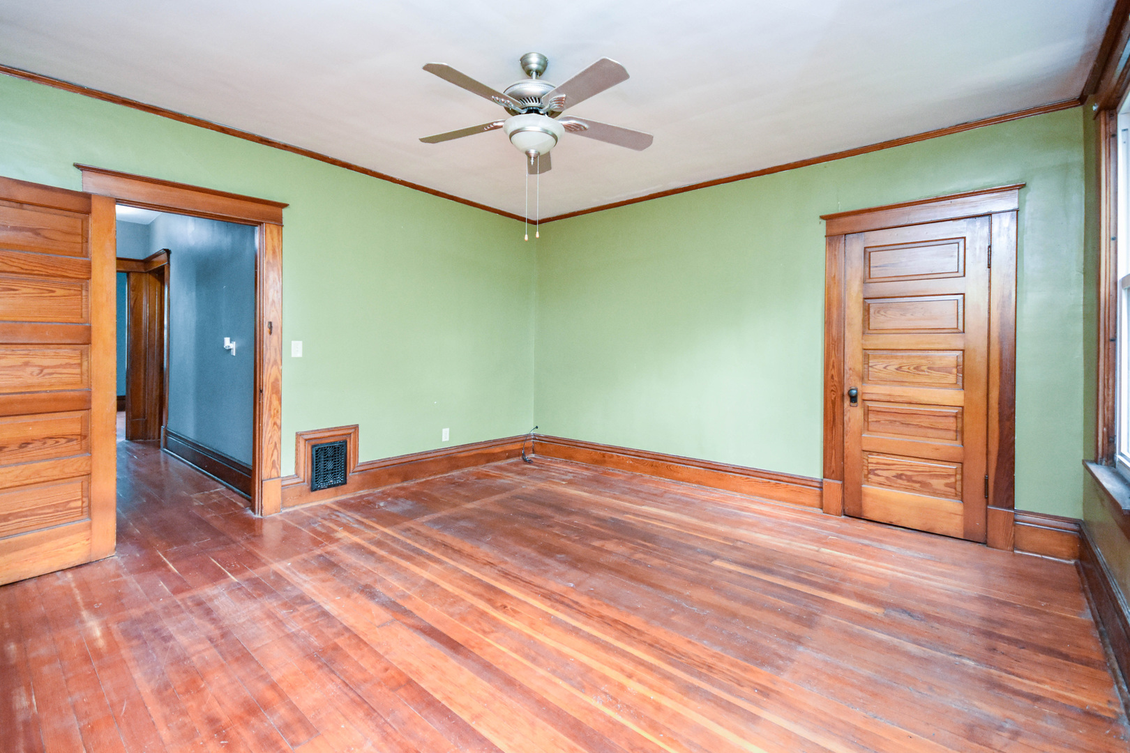413 North 3rd Street Dunlap, IL 61525 - Photo 34 of 41 an empty room with wooden floor and a ceiling fan