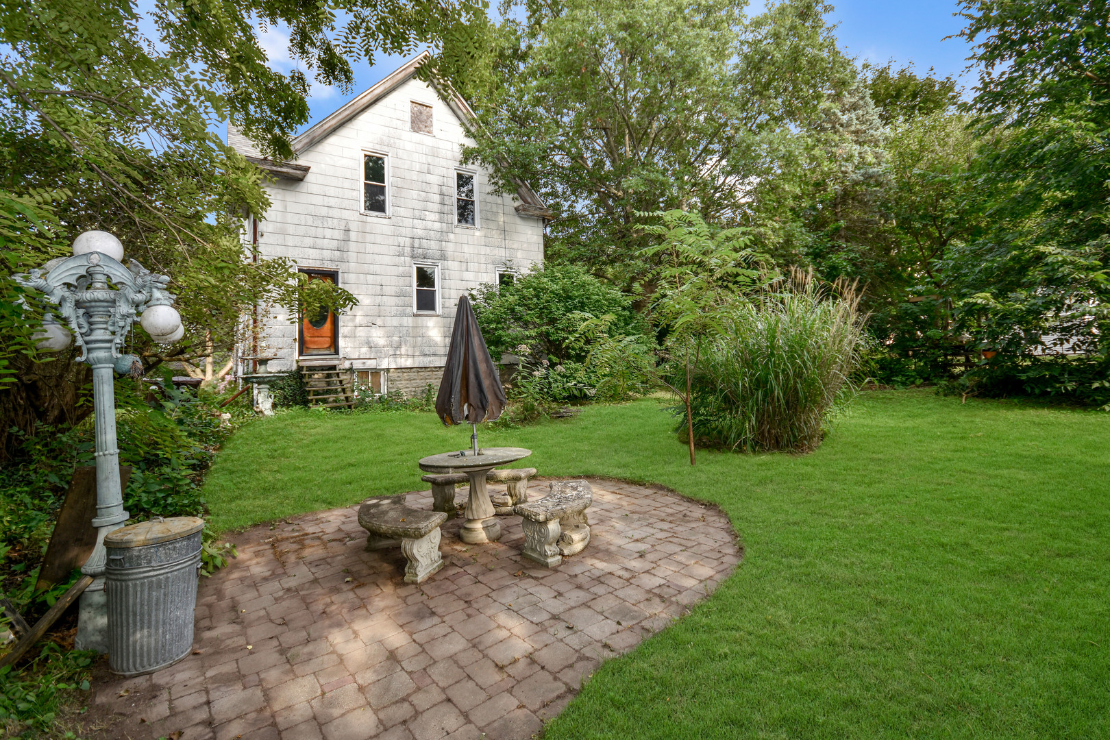413 North 3rd Street Dunlap, IL 61525 - Photo 39 of 41 a view of a white house with a yard and sitting area