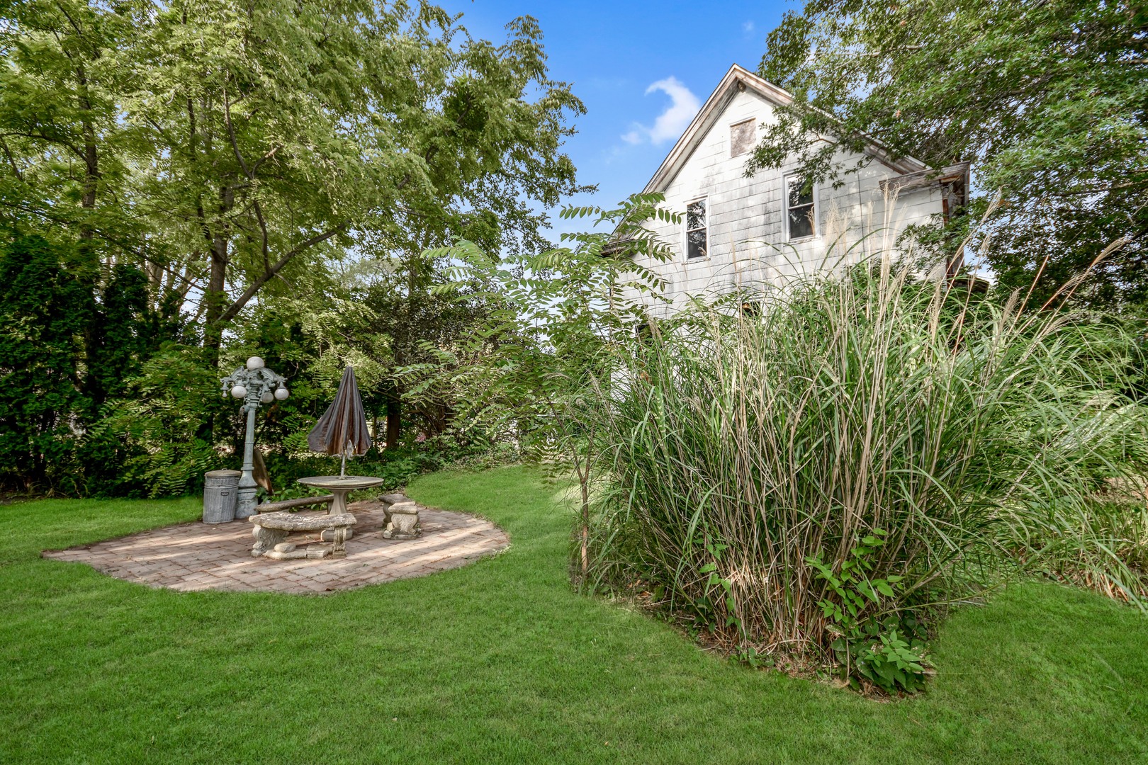 413 North 3rd Street Dunlap, IL 61525 - Photo 40 of 41 a view of a fountain in the middle of a garden