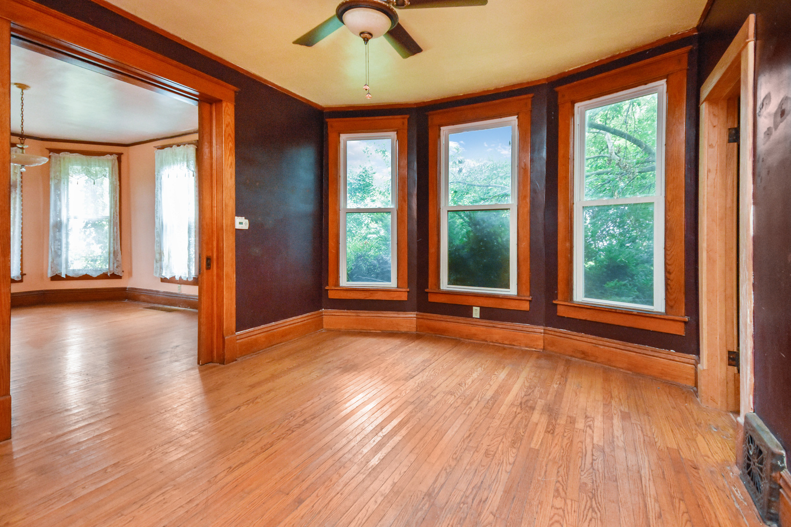 413 North 3rd Street Dunlap, IL 61525 - Photo 8 of 41 a view of an empty room with wooden floor and a window