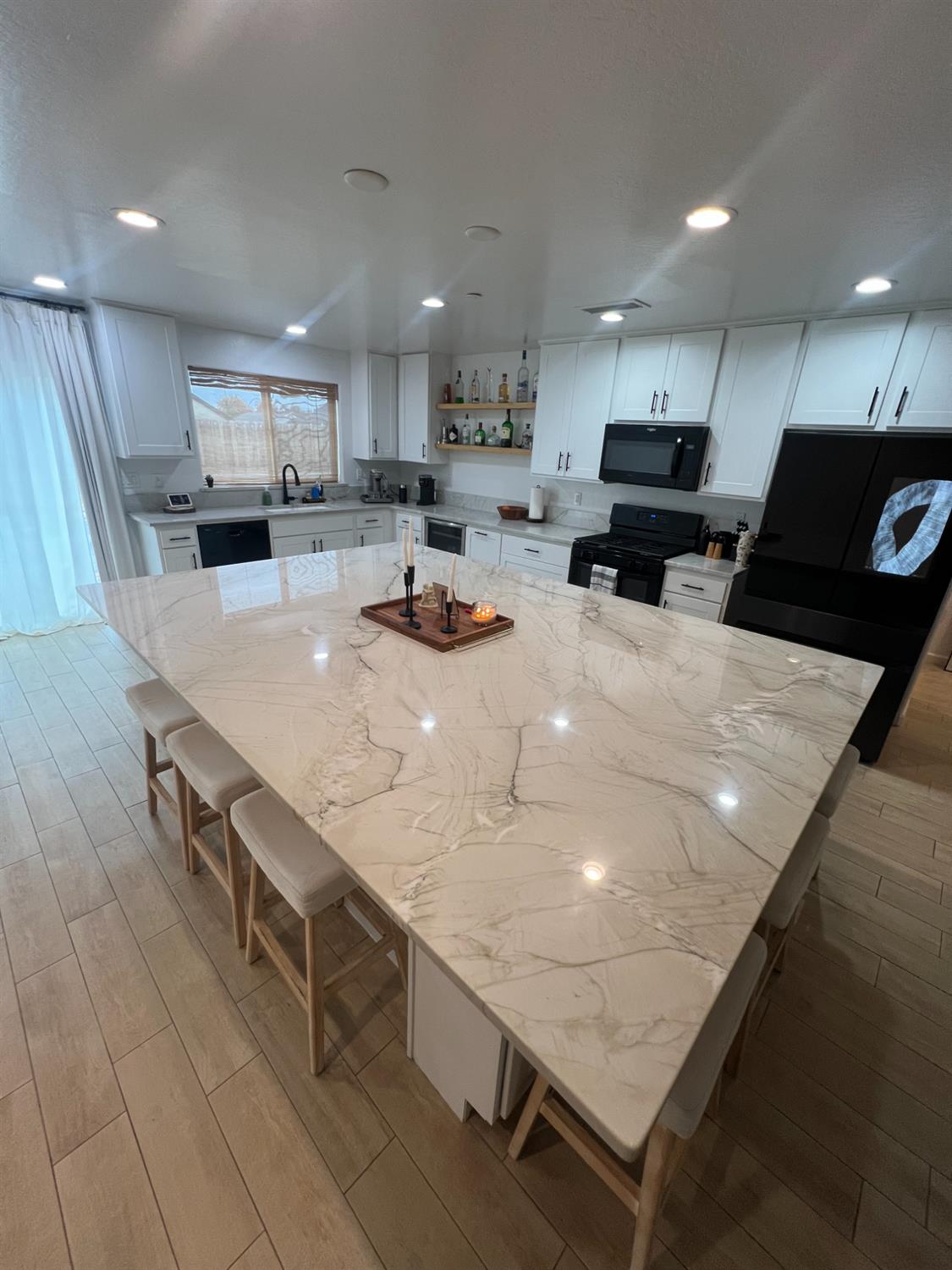 788 Apple Street Dinuba, CA 93618 - Photo 13 of 46 a large kitchen with stainless steel appliances lots of counter space