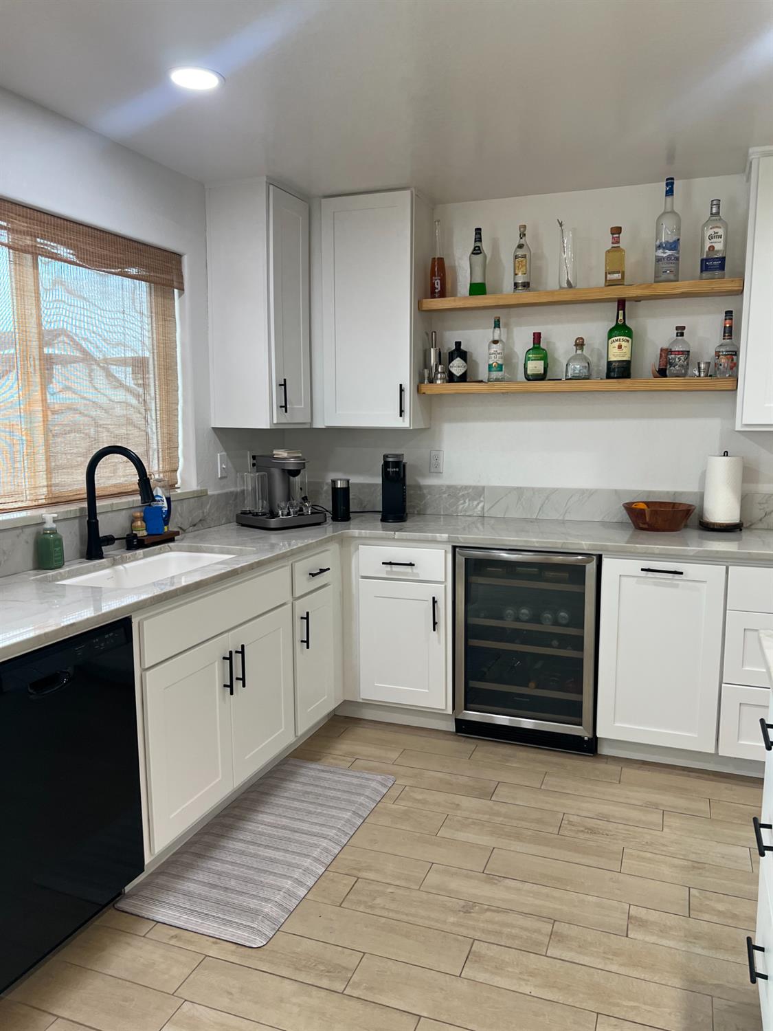 788 Apple Street Dinuba, CA 93618 - Photo 17 of 46 a kitchen with stainless steel appliances a stove sink and cabinets