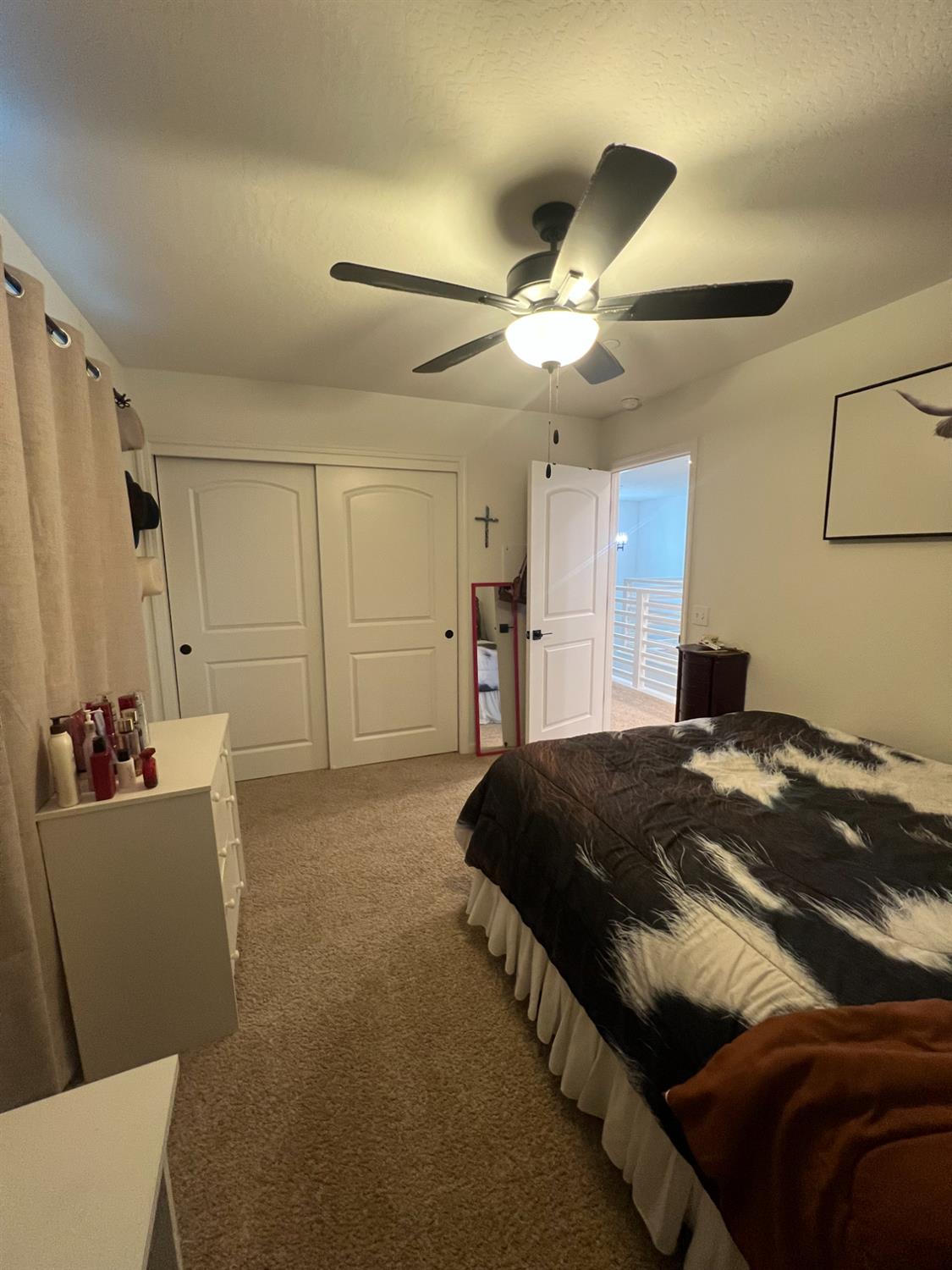 788 Apple Street Dinuba, CA 93618 - Photo 43 of 46 a bedroom with a bed and a chandelier