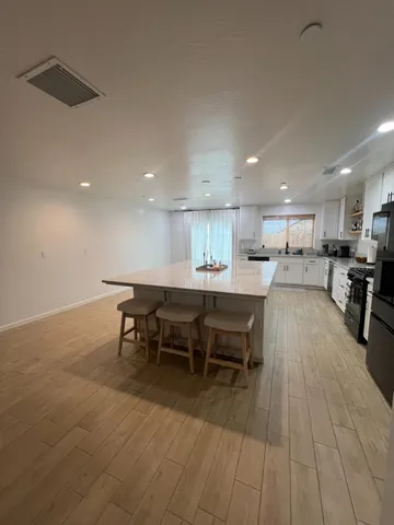 a kitchen with a table and chairs in it