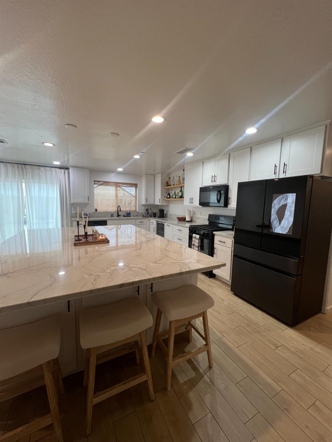 788 Apple Street Dinuba, CA 93618 - Photo 10 of 46 a kitchen with a table and chairs in it
