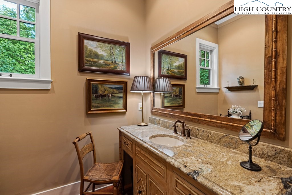 210 Farm Loop Road Banner Elk, NC 28604 - Photo 14 of 48 a bathroom with a sink and a mirror