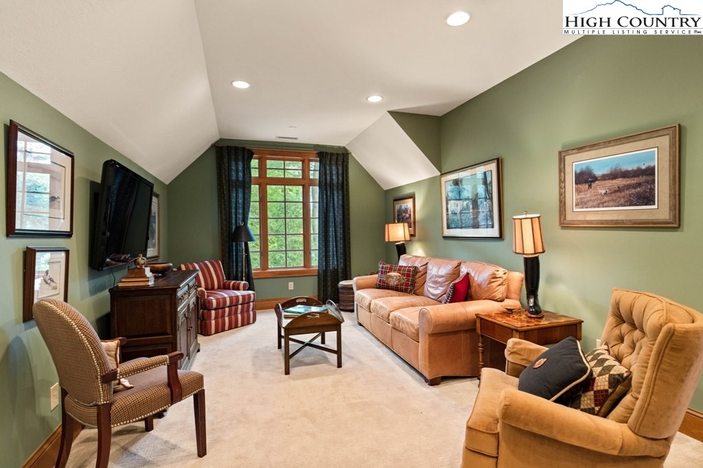 210 Farm Loop Road Banner Elk, NC 28604 - Photo 20 of 48 a living room with furniture and a flat screen tv