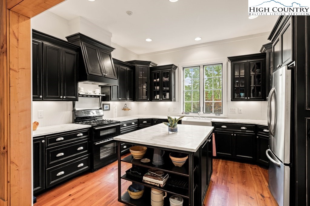 210 Farm Loop Road Banner Elk, NC 28604 - Photo 27 of 48 a kitchen with a sink appliances and cabinets