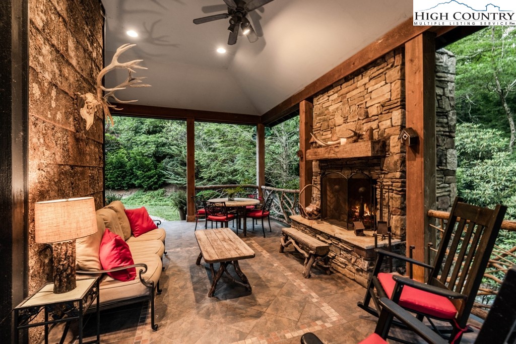 210 Farm Loop Road Banner Elk, NC 28604 - Photo 3 of 48 a outdoor living space with furniture and garden view