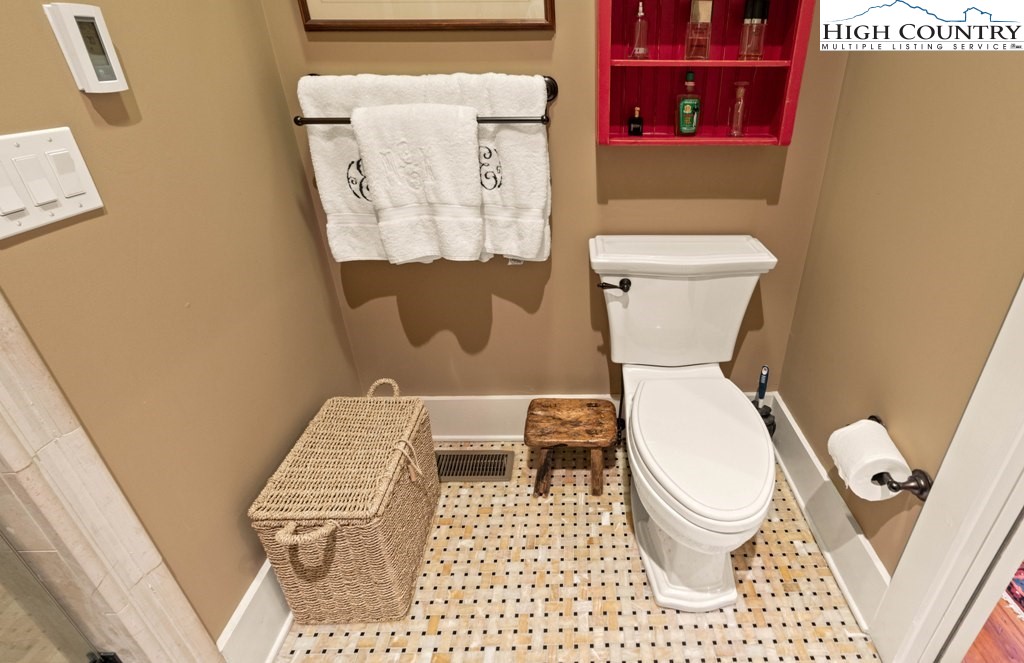 210 Farm Loop Road Banner Elk, NC 28604 - Photo 33 of 48 a white toilet sitting next to a shower