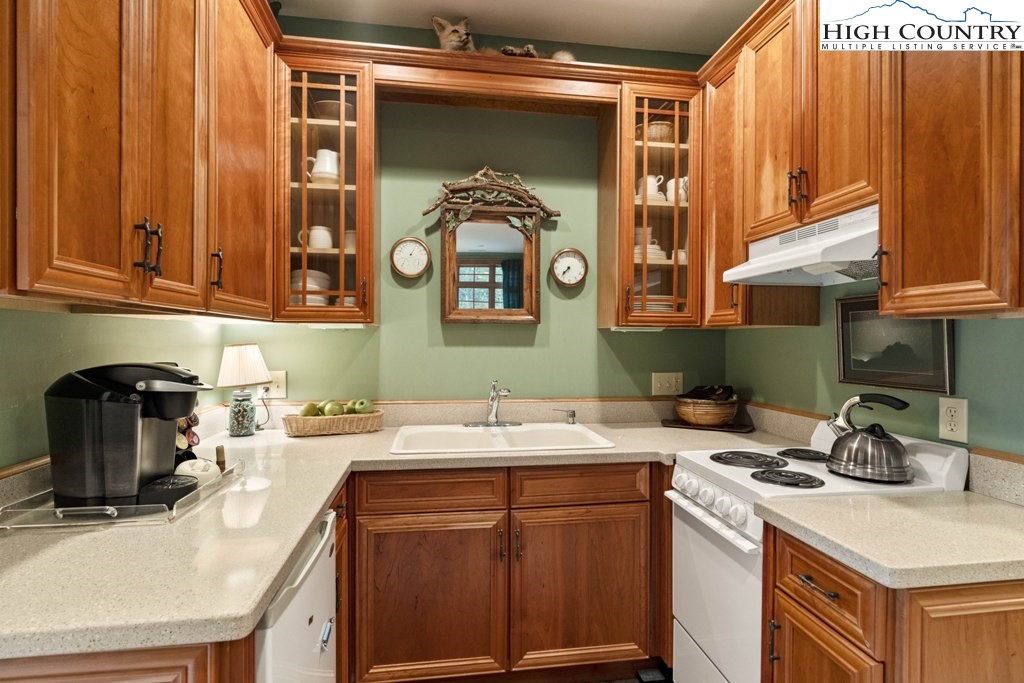 210 Farm Loop Road Banner Elk, NC 28604 - Photo 41 of 48 a kitchen with a sink and cabinets