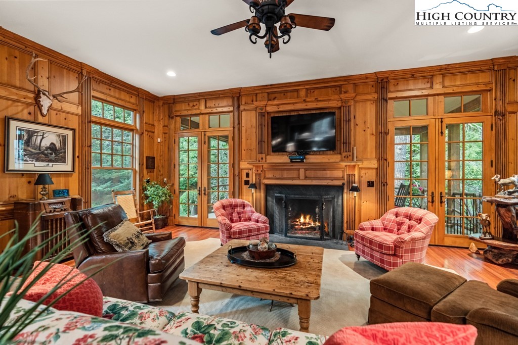 210 Farm Loop Road Banner Elk, NC 28604 - Photo 5 of 48 a living room with furniture a fireplace and a flat screen tv