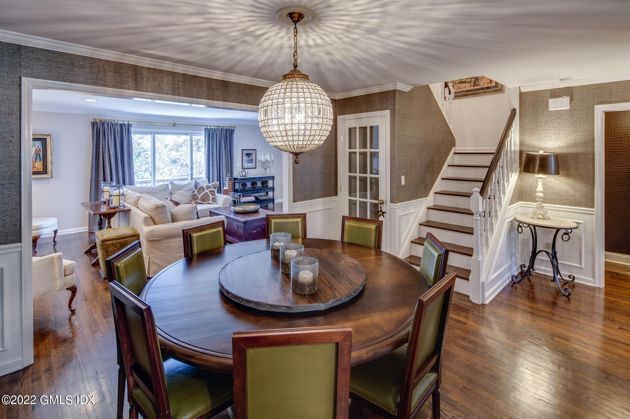 78 River Road, Unit 3 Cos Cob, CT 06807 - Photo 5 of 17 a view of a dining room with furniture wooden floor and chandelier