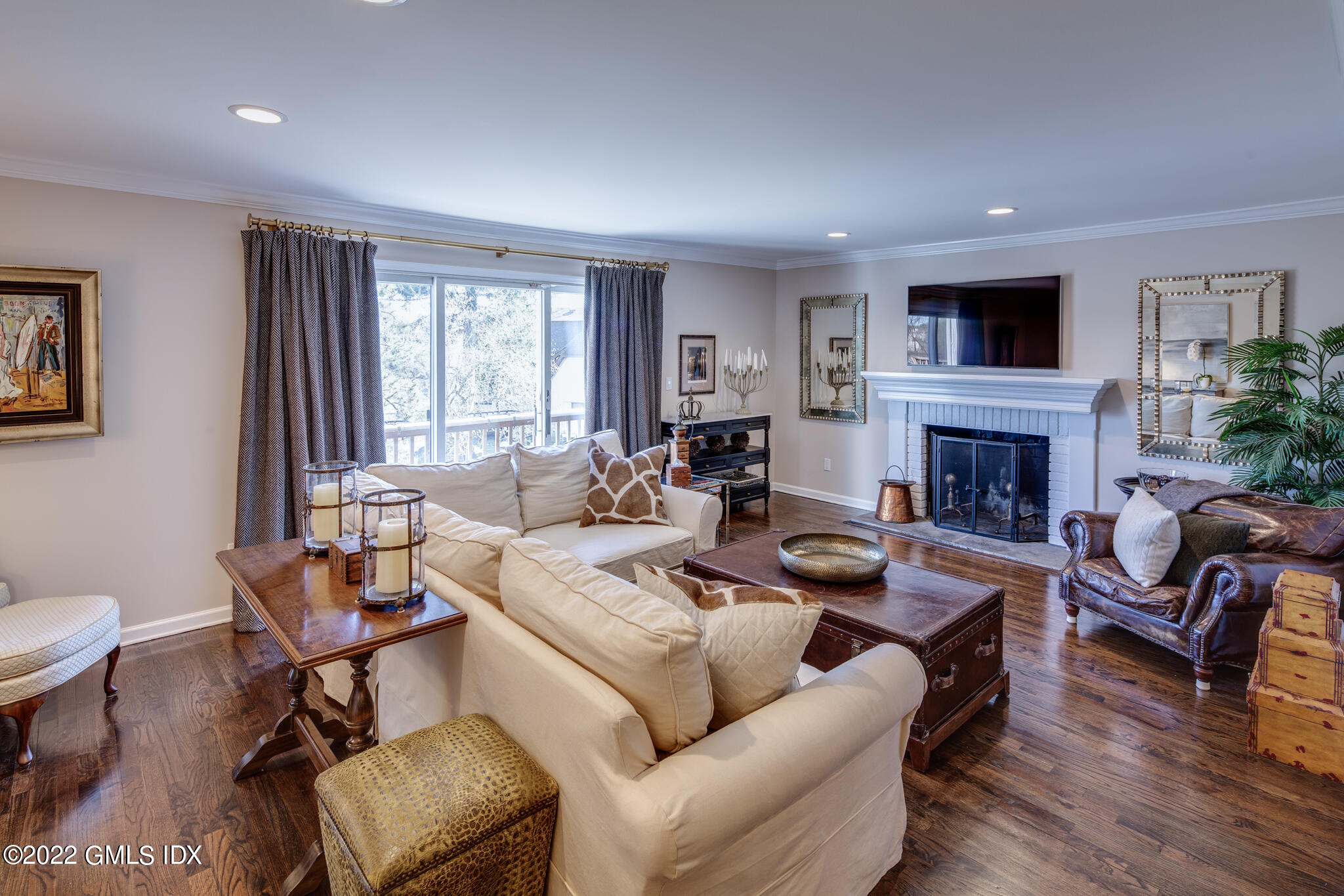 78 River Road, Unit 3 Cos Cob, CT 06807 - Photo 8 of 17 a living room with furniture a fireplace and a window