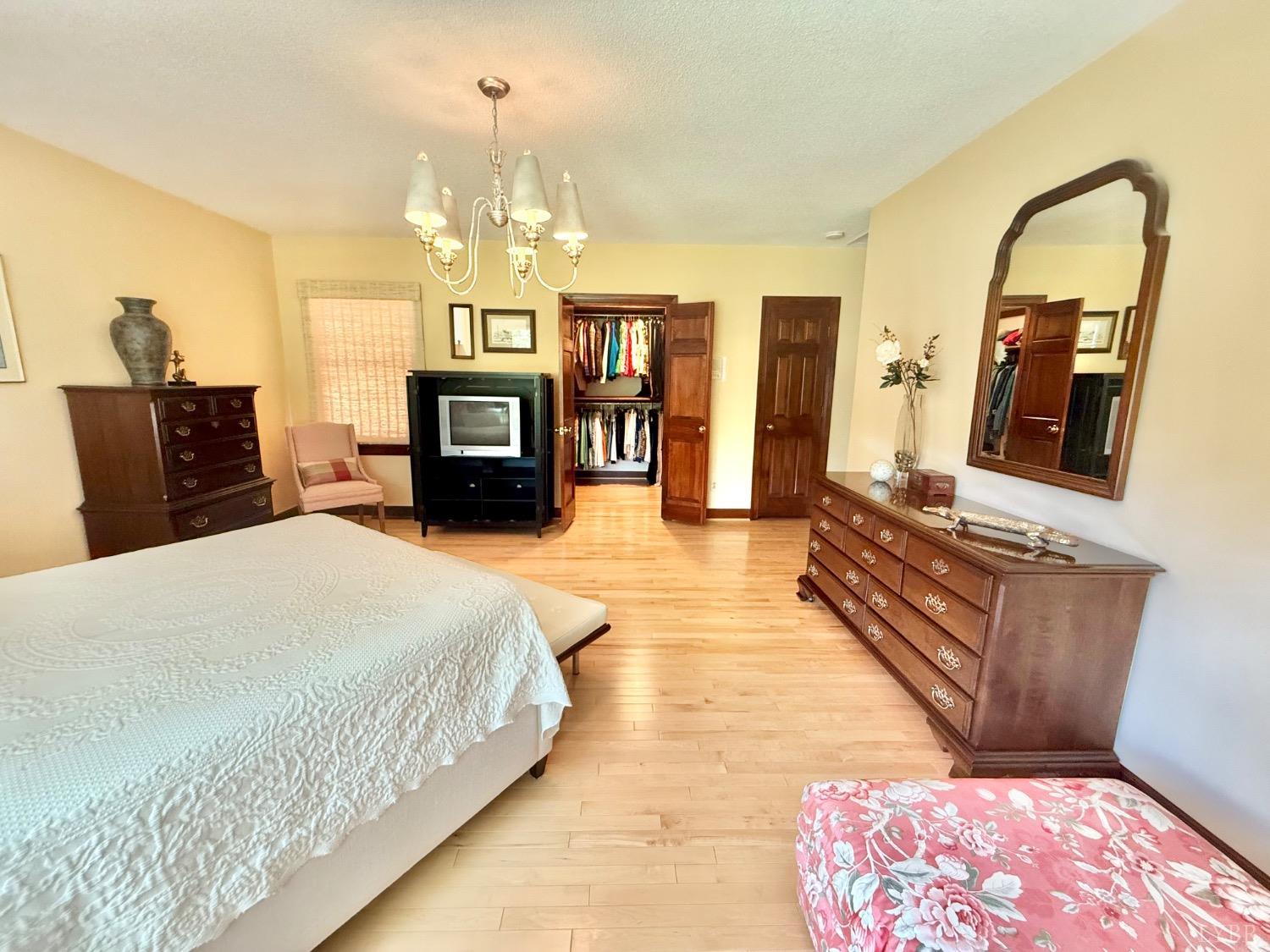 306 Quail Meadows Drive Forest, VA 24551 - Photo 19 of 57 a spacious bedroom with a bed and a dresser