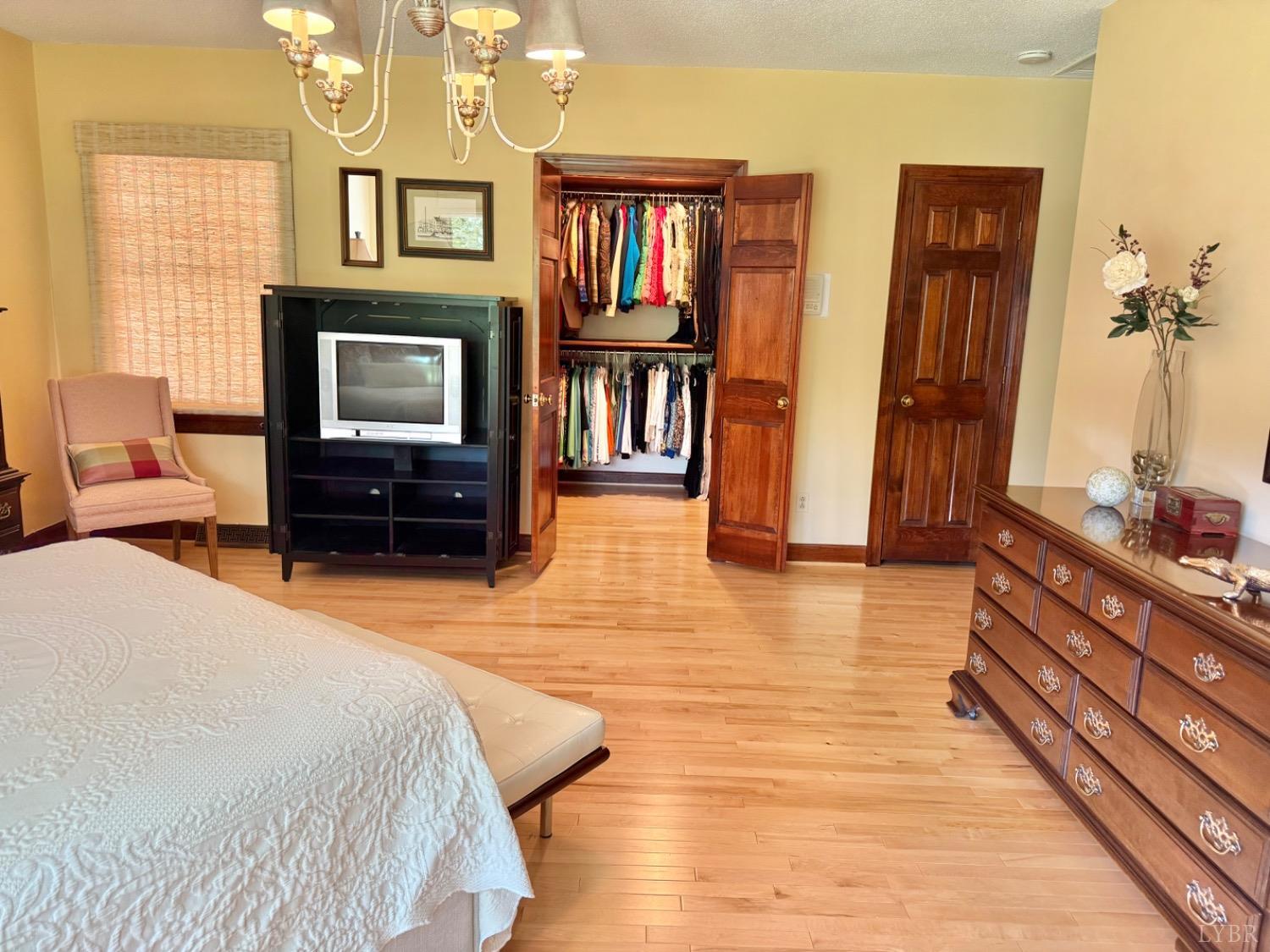 306 Quail Meadows Drive Forest, VA 24551 - Photo 20 of 57 a bedroom with furniture and a flat screen tv