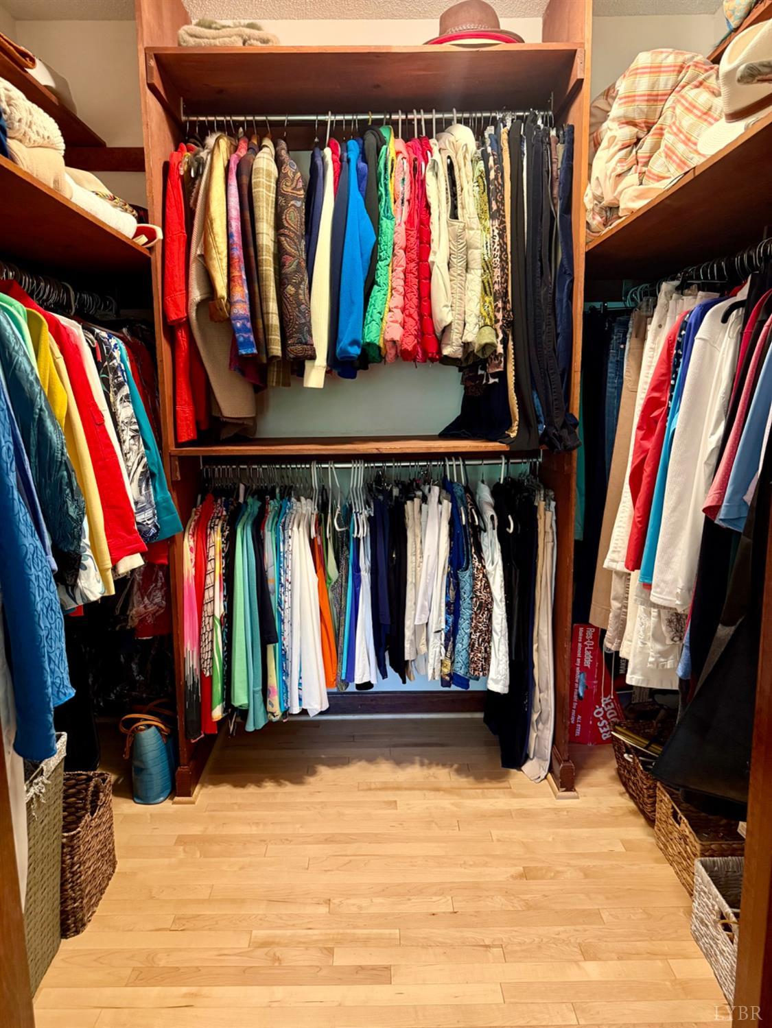 306 Quail Meadows Drive Forest, VA 24551 - Photo 21 of 57 a view of walk in closet with clothes and shoes