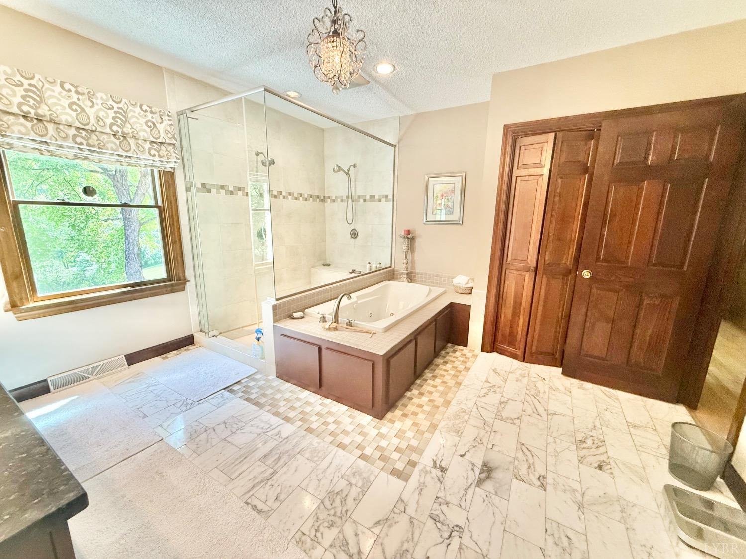 306 Quail Meadows Drive Forest, VA 24551 - Photo 23 of 57 a spacious bedroom with a bed and a window