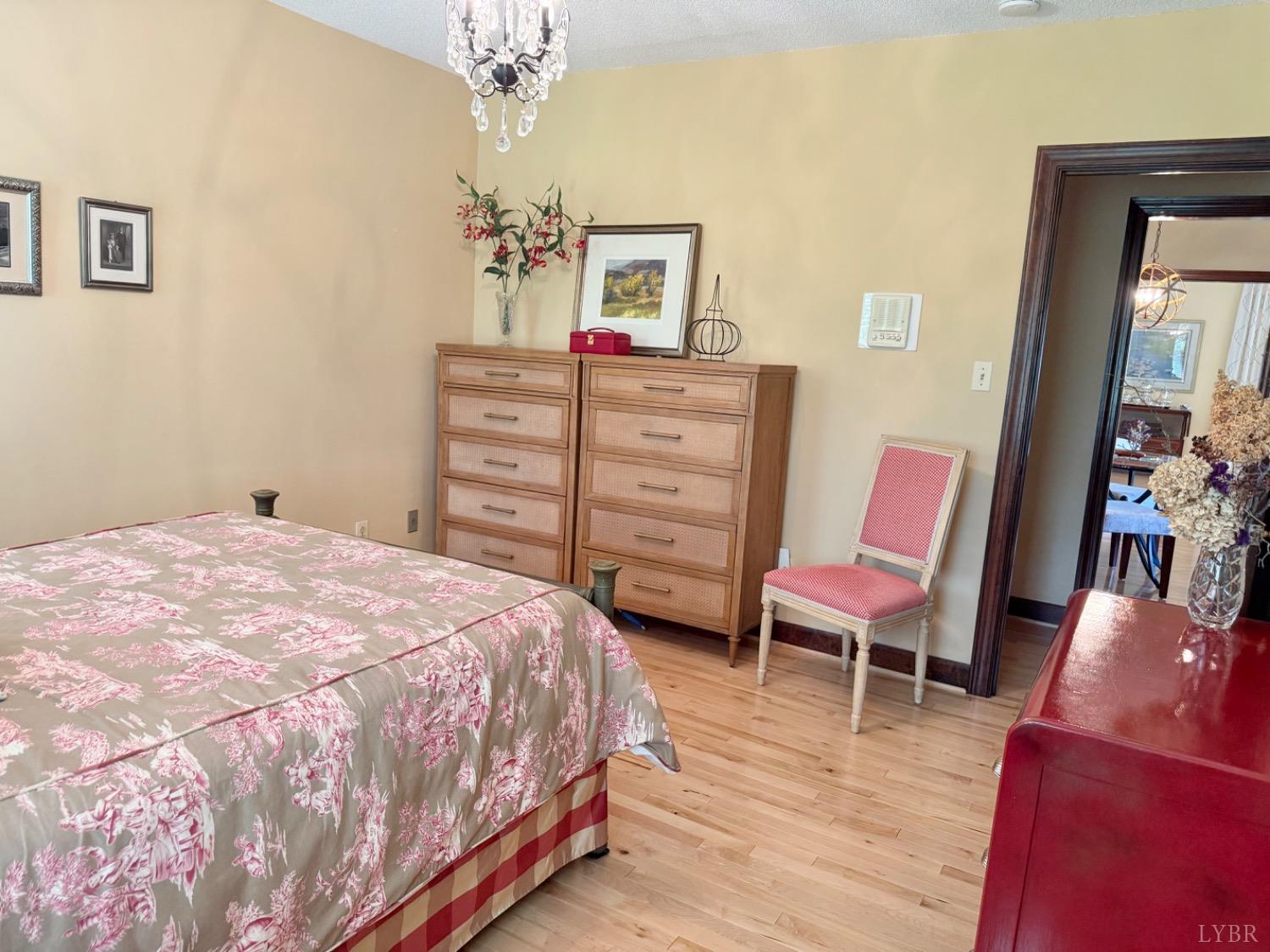 306 Quail Meadows Drive Forest, VA 24551 - Photo 30 of 57 a bedroom with a bed and a chair