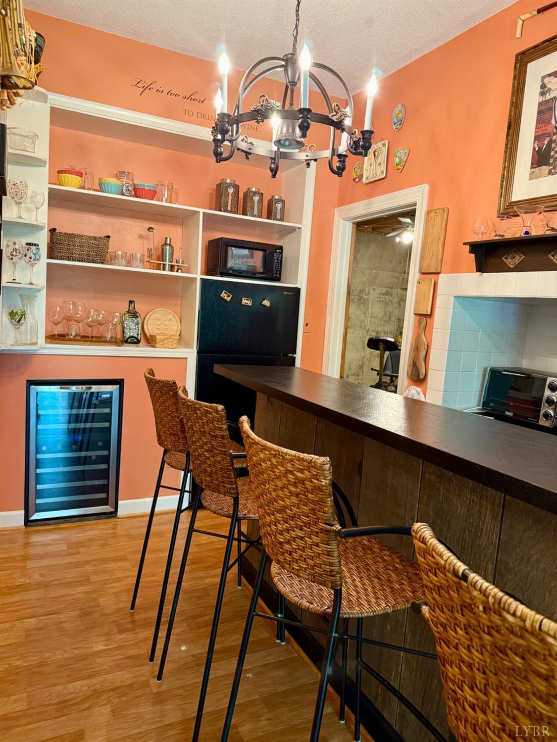 306 Quail Meadows Drive Forest, VA 24551 - Photo 36 of 57 a dining room with furniture and wooden floor