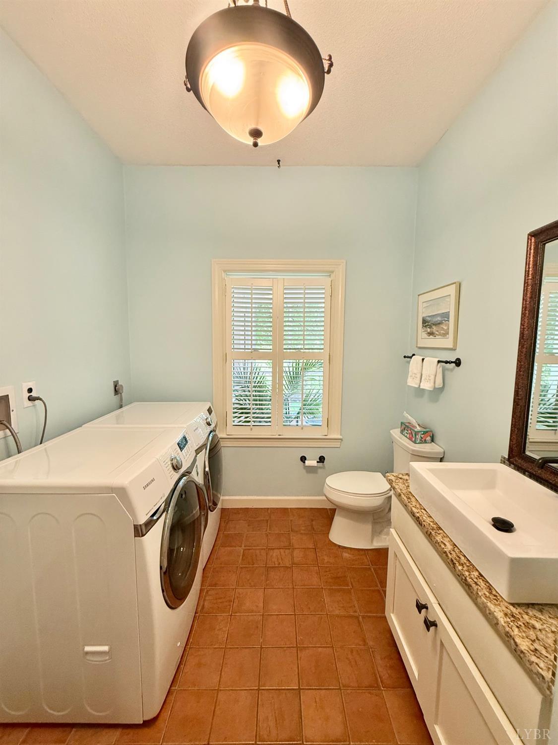306 Quail Meadows Drive Forest, VA 24551 - Photo 39 of 57 a bathroom with a sink a toilet and a mirror