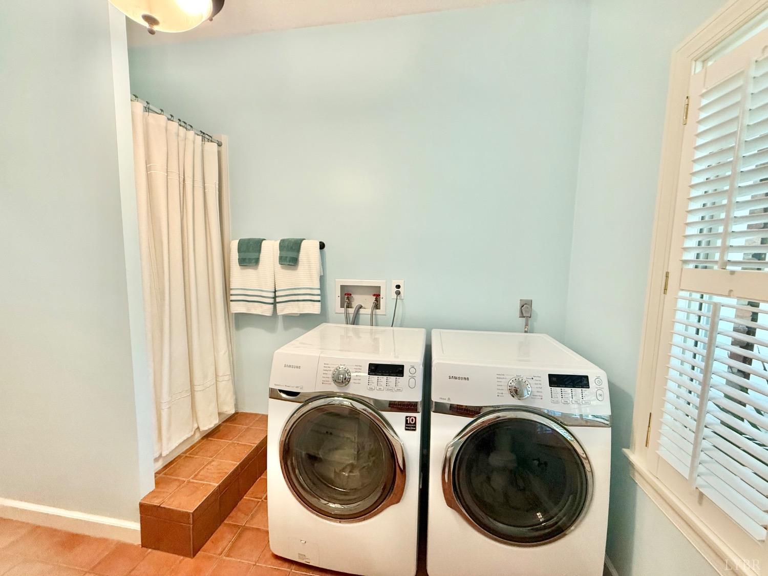 306 Quail Meadows Drive Forest, VA 24551 - Photo 40 of 57 a utility room with dryer and washer