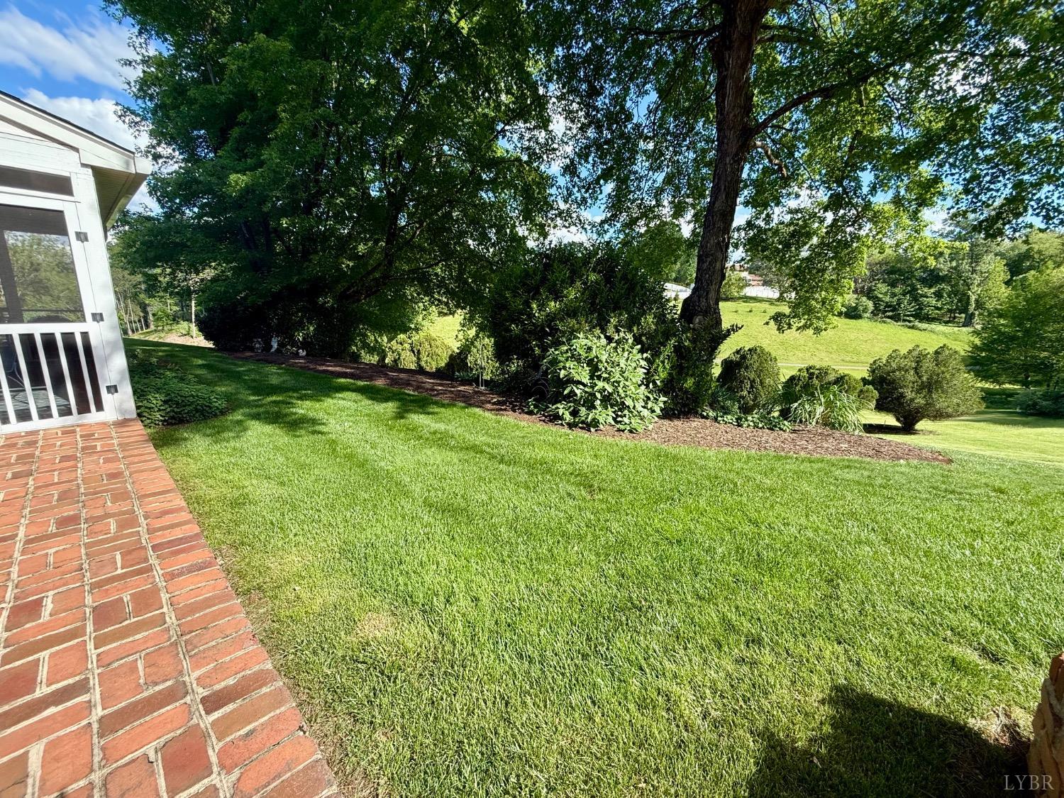 306 Quail Meadows Drive Forest, VA 24551 - Photo 45 of 57 a view of a yard with plants and trees