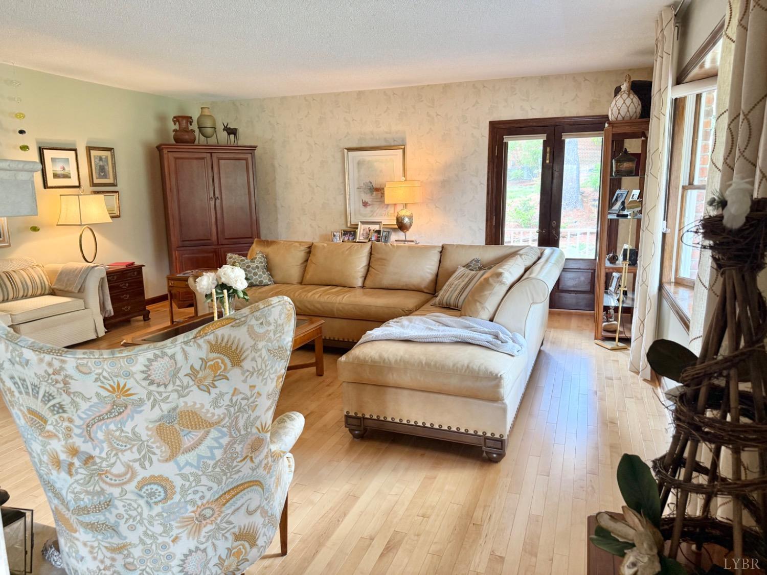 306 Quail Meadows Drive Forest, VA 24551 - Photo 6 of 57 a living room with furniture and a flat screen tv